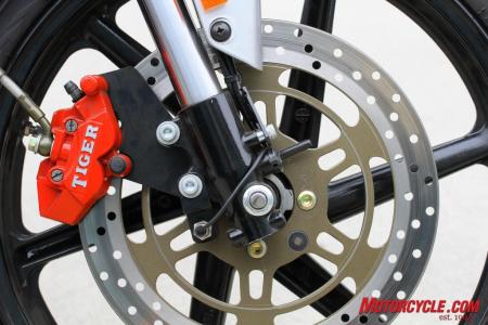 featured motorcycle brands, Twin pot front calipers work with a 290mm rotor for decent whoa power Note speedo sensor pickup on rotor in line with mounting bolts