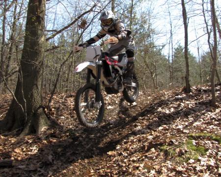 2010 husqvarna tc 250 review motorcycle com, It s a motocross bike but where the Husky TC 250 really excels is woods racing