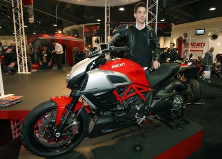 2010 long beach progressive ims report, Nicky Hayden stands by a bike that is to traditional Ducatis what the Cayenne SUV was to Porsche automobiles Photo by Brian J Nelson