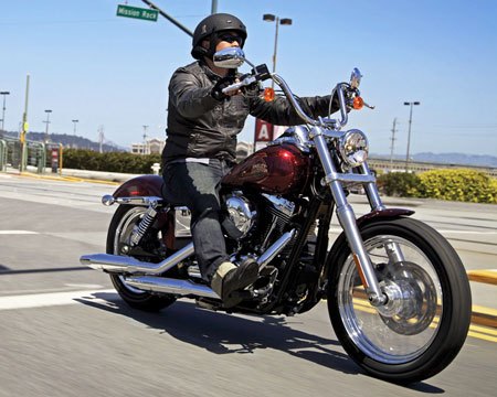 2012 harley davidson dyna street bob review motorcycle com, Slow speed handling can be awkward at times thanks to the high reach bars Nevertheless the bike s handling including ease of steering and decent lean angle clearance is satisfactory The Street Bob pictured is a 2013 model