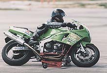 custom bike california superbike school s lean slide bike motorcycle com, The slide bike allows instructors to watch students closely Here an instructor noticed the student s outside foot too far back giving him less leverage to lean off