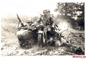 bikes of the blitzkrieg, Trained to meet all challenges the sidecar teams sloshes through muddy bog in what is most likely a scene from pre war training as the soldiers are wearing early style WW1 helmets
