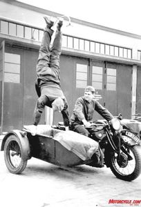 bikes of the blitzkrieg, Grandstanding Most likely a member of the popular German motorcycle stunt teams prior to the war this soldier does an impromptu handstand on his BMW s sidecar