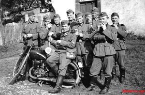 bikes of the blitzkrieg, Team of cycle soldiers with the tell tale round signal sign indicating traffic control one of the many duties assigned the motorized infantry
