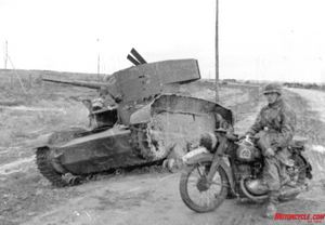 bikes of the blitzkrieg, German trooper poses beside a knocked out Russian tank At Kursk in the southern Ukraine in July 1943 the largest armored battle in history shook the earth The Wehrmacht suffered an estimated 210 000 killed and wounded the Soviets 178 000