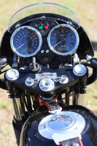 2011 moto guzzi v7 racer review motorcycle com, LCD readouts belie the V7 s vintageness but the color matched leather tank strap is sweet vintage touch