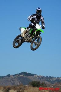 2010 kawasaki kx450f review motorcycle com, The KX s new suspension had no trouble handling big air off of Pala s double jumps