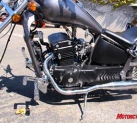 2009 johnny pag motorcycles review motorcycle com, The tidy 270cc twin cylinder engine has finned cylinders that belie its liquid cooled status The radiator is partially hidden between the frame downtubes