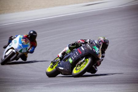 2012 fim e power ttxgp laguna seca race report, Eric Bostrom 32 made his e bike racing debut for the Team Icon Brammo team at Laguna Seca Behind him is Katja Poensgen 65 of Muench Racing the first woman to score points in 250cc grand prix racing