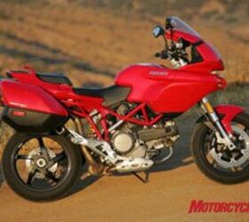 2009 ducati multistrada 1100 s review motorcycle com, The standard model seen here with accessory hard luggage is no longer available in the U S leaving the S model with Ohlins front and rear and various carbon bits as the only Multitrada for 2009 Both models share the same frame and engine
