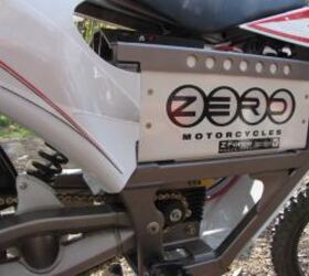 2010 zero mx extreme package review motorcycle com, The burly frame and swingarm are wrapped around an electric motor that is surprisingly powerful The Lithium Ion battery is landfill safe