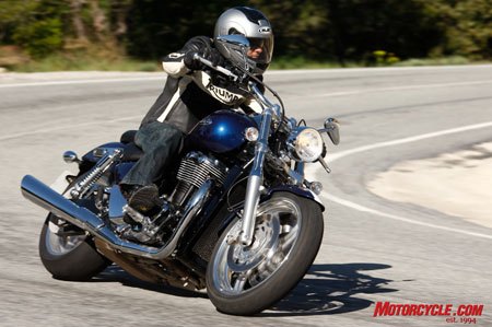 2010 triumph thunderbird review motorcycle com, The Thunderbird s chassis is a stable platform and corner speed is limited only by its footpeg clearance Accessory mirrors with lightening holes are more stylish but vibrate unlike the stockers