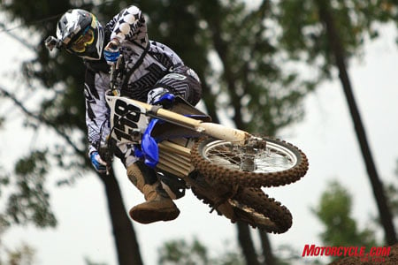 2010 yamaha yz450f review motorcycle com, Not quite a full Bubba scrub but far from Fonzie s ride position on the track