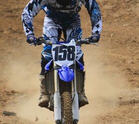 2010 yamaha yz450f review motorcycle com, Taller riders might find the cockpit of the new YZ a little tight but it s easily rectified with a quick forward adjustment of the handlebars