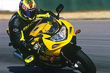 2001 suzuki gsx r600 motorcycle com, Despite the mid corner bumps at Road Atlanta the new GSX R s chassis remained settled even at triple digit speeds