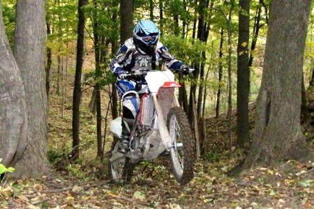 2010 honda crf250r review motorcycle com, Sometimes a good bike is a good bike no matter where you ride it The CRF250R rages in the woods right out of the box With a few simple mods it would make an excellent hare scramble machine