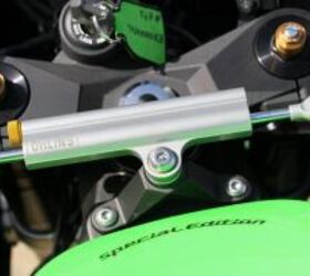 2010 kawasaki zx 10r review motorcycle com, A new Ohlins steering damper offers increased damping for aggressive track use