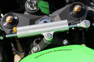 2010 kawasaki zx 10r review motorcycle com, A new Ohlins steering damper offers increased damping for aggressive track use