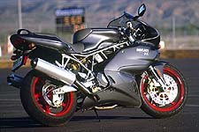 motorcycle com, As the corners open up and speed increases the Ducati comes more into its own maintaining that high speed stability Ducatis are famous for