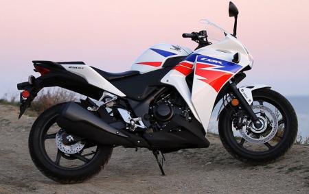 2013 beginner sportbike shootout video motorcycle com, Honda s venerable CBR250R has livened up the entry level sportbike class since its debut in 2011