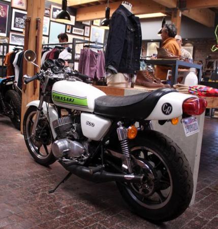 inside deus ex machina, Kawasaki s 500 Triple was and still is a two stroke terror At Deus it s just part of the decor