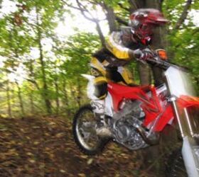 2010 honda crf450r review motorcycle com, In the woods the instant throttle response of the CRF450 can simply be too much too soon