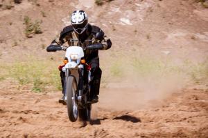 2012 husqvarna te250 review motorcycle com, Just like a true dirt dedicated bike the TE s suspension works better the harder you ride it says Content Editor Tom Roderick