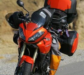 2008 triumph tiger review motorcycle com, Fonzie disappeared into thin air leaving his matching orange patched Stich behind once he learned he had to photograph and video yet another bike test
