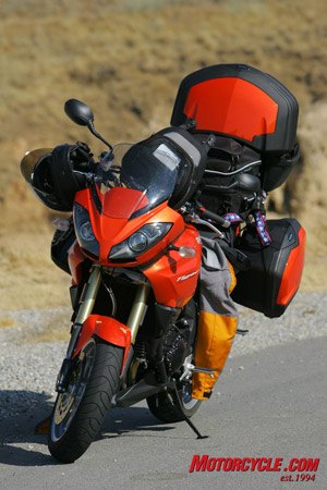 2008 triumph tiger review motorcycle com, Fonzie disappeared into thin air leaving his matching orange patched Stich behind once he learned he had to photograph and video yet another bike test