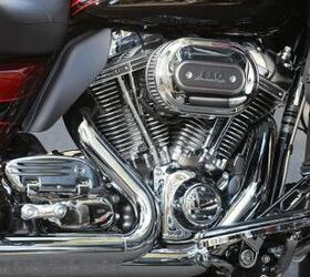 2011 harley davidson cvo road glide ultra review motorcycle com, Chrome glorious chrome The Road Glide Ultra is slathered in it looking especially tasty in the Screamin Eagle TC110 engine compartment Note the heat deflector behind the rear cylinder to deflect hot air away from a rider s leg