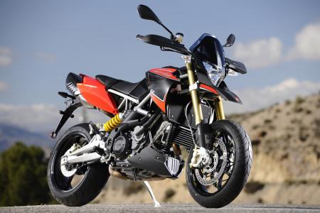 2012 aprilia dorsoduro 1200 review motorcycle com, The new 2012 Aprilia Dorsoduro 1200 may look almost the same as last year s but it s received some significant changes