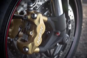 2013 triumph street triple r review motorcycle com, The four pot radially mounted Nissin front brakes and adjustable Kayaba suspension are worth more than the 600 bump for the R model Curiously Triumph uses Nissin calipers up front but a Brembo caliper in the rear