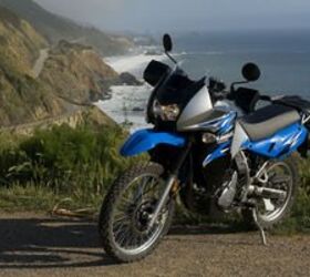 riding with the wind of change motorcycle com, the KLR is regarded by many as the standard among adventure type motorcycles