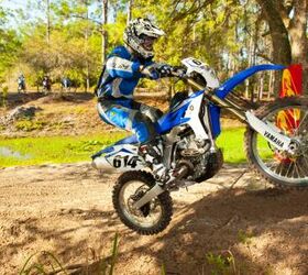2012 yamaha wr450f review motorcycle com, Throttle response makes lifting the front end easier than previous versions of Yamaha s WR With its lower seat height and less stink bug feel the WR is more usable in all technical trail situations