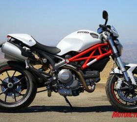 2011 ducati monster 796 review motorcycle com, Chunky but artful looking steel tube trellis main frame is shared across the Monster line The 796 gets the Monster 1100 s wheels swingarm and tires