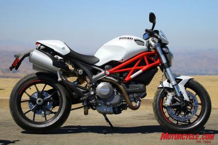 2011 ducati monster 796 review motorcycle com, Chunky but artful looking steel tube trellis main frame is shared across the Monster line The 796 gets the Monster 1100 s wheels swingarm and tires