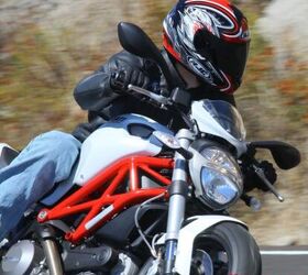 2011 ducati monster 796 review motorcycle com, Micro bikini fairing comes standard One piece tubular handlebar is a little less than an inch higher than the Monster 1100 s bar The headlight is identical to headlights on the 696 and 1100
