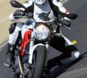 2011 ducati monster 796 review motorcycle com, Editor Jeff Cobb easily plants a knee while strafing canyons aboard the new Monster 796 He found that although the footpegs touch down now and then they are high enough that you re a hero if you do it regularly