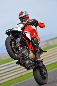 2010 ducati hypermotard 1100 evo evo sp review motorcycle com, You can t help but be a wheelie God on the either Hypermotard EVO