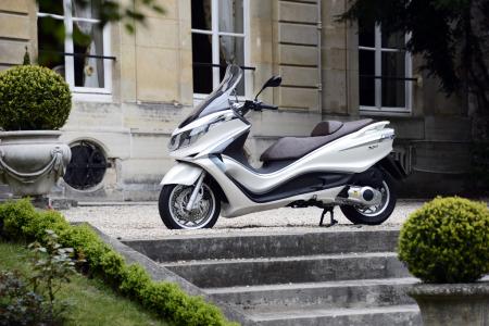 2012 piaggio x10 350 review motorcycle com, The Italian Embassy in Paris offers an elegant backdrop for the launch of the Piaggio X10 the Italian manufaturer s new flagship maxi scooter
