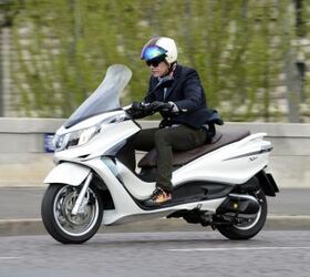 2012 piaggio x10 350 review motorcycle com, The tall windscreen provides more than adequate wind protection