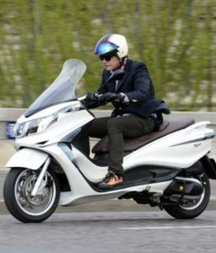 2012 piaggio x10 350 review motorcycle com, The tall windscreen provides more than adequate wind protection