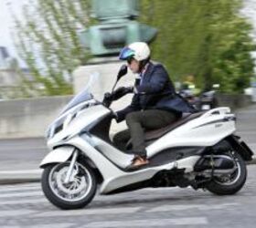2012 piaggio x10 350 review motorcycle com, The rudimentary traction control system proved to be a bit obtrusive on the wet streets and riding over painted lines