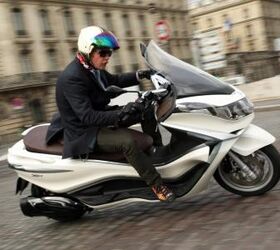 2012 piaggio x10 350 review motorcycle com, The cobblestone streets of Paris proved to be a challenge for the X10 s rear suspension