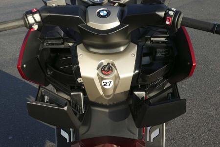 2013 bmw c600 sport c650 gt review video motorcycle com, Both models offer dual non locking glove compartments Our testers were equipped with heated seats and handgrips a luxury of the Highline Package