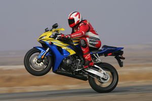 2006 honda cbr 1000rr motorcycle com, There isn t a photo of his near loop and this is the closest Sean would come to a big wheelie for the rest of the day There s no question this new CBR is a harder hitting motorcycle