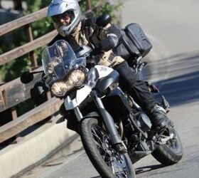 2011 triumph tiger 800 800xc review video motorcycle com, The XC version of the Tiger is recognizable by its high beak like front fender