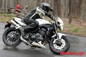 2008 triumph urban sports review motorcycle com, Attractive new wheels roll through puddles while slip on Arrow exhaust canisters add a dash of flash