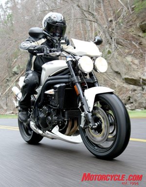 2008 triumph urban sports review motorcycle com, With its distinctive twin round headlamps the Speed Triple retains its iconic streetfighter persona