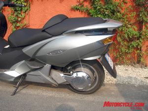 2008 vectrix electric scooter motorcycle com, Considering the small size of the brushless DC motor the finned maxi wheel hub it packs some serious punch All Vectrix needs to do to create a Silver Wing beater is add one to the front wheel too